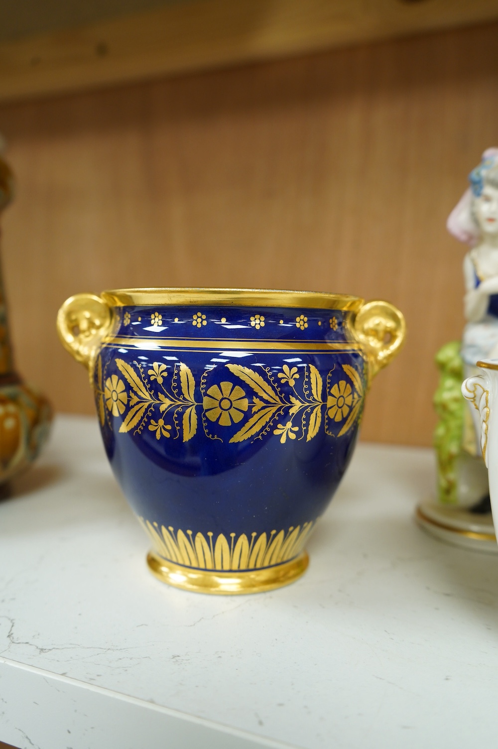 Capo di monte; a pair of figures, a pair of blue and gilt pots and a white and gilt Napoleonic monogrammed pot, tallest item 16.5cm high. Condition - fair